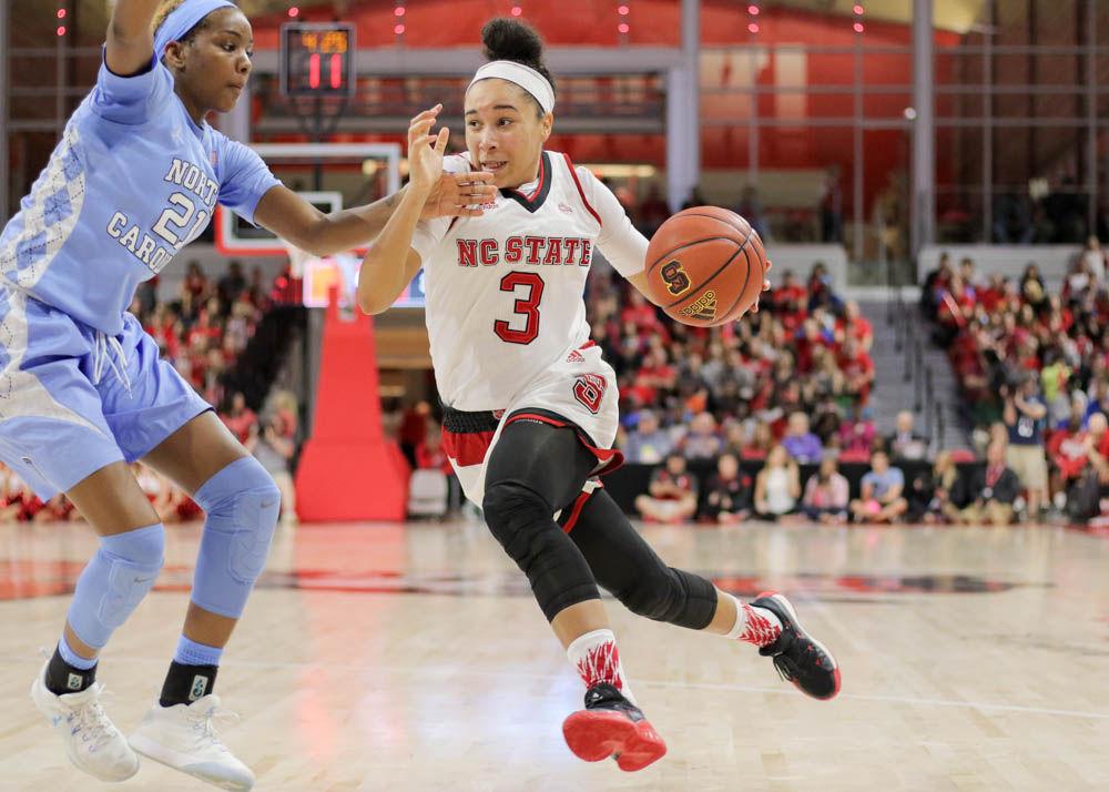 Senior guard Miah Spencer pushes toward the interior, past the UNC defense. Spencer was one point and one assist away from a double-double, playing only 20 minutes because of early foul trouble. The Wolfpack dominated the Heels on route to a 80-60 victory in Reynolds Coliseum on Feb. 23.
