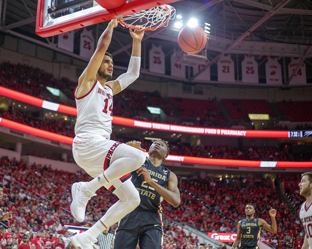Sophomore center Omer Yurtseven slams home a dunk. Yurtseven had 13 points and eight points in his 21 minutes of play during the 92-72 dominant performance over Florida State on Sunday, Feb. 25 in PNC Arena.
