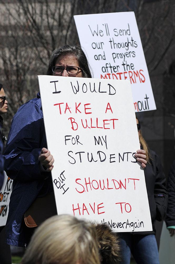 Protesters hold signs and listen to the protest speakers at the "March for Our Lives" in downtown Raleigh on Saturday, March. 24, 2017. The protest called for "common sense gun reform" in the wake of the multitude of mass shootings that have taken place in the United States school system.