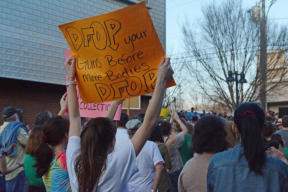 Two friends, Kate Butler and Marissa Roberts participate in the Student's March on the Capitol on Tuesday. Butler, a psychology major at NC State University, and Roberts, in her gap year but planning to attend NC State in the fall, decided to join this protest because, "Change is long overdue for this,".