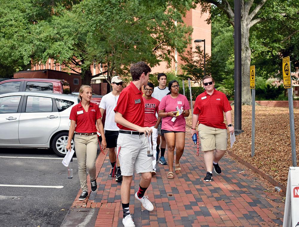 Peer mentors Emma Bartlett, Mitchell Moravec and Isaiah Lewis guide students around NC State's campus to point out where their classes are going to be held during Summer Session II. The tour was part of the Wolfpack Wondering event that took place on Sunday, June 25, 2017.