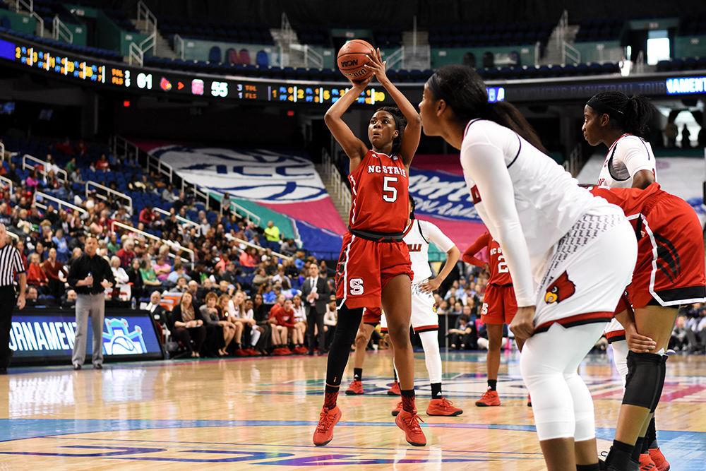 Senior forward Chelsea Nelson shoots a free throw at the ACC women's basketball semifinal against Louisville in Greensboro Coliseum on Saturday. The Wolfpack lost to the Cardinals with a final score of 64-59.