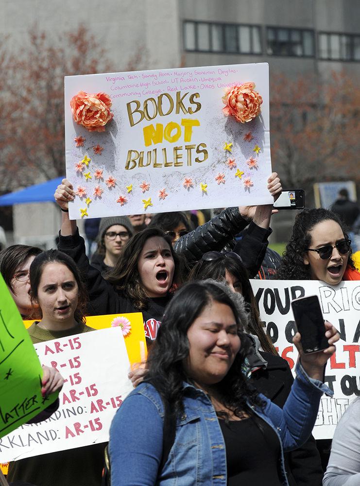 Zari, a protester from Waldorf School in Chapel Hill chants and holds up her sign with her fellow protesters at the "March for Our Lives" in downtown Raleigh on Saturday, March. 24, 2017. Zari attended the protest with friends Vivienne English and Blake Warren also from Waldorf School, an institution which did not penalize students for participating in the organized "walk out" in weeks prior. The protest called for "common sense gun reform" in the wake of the multitude of mass shootings that have taken place in the United States school system.