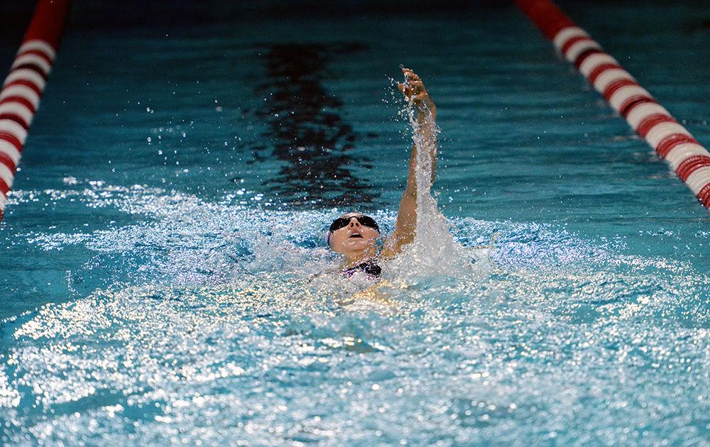 Junior Hannah Moore swims the backstroke in the 400-meter individual medley during NC State's meet against the University of Wisconsin on Oct. 22, 2016, in the Carmichael Aquatics Center. Moore finished the heat with a time of 4:15. NC State won their meet against Wisconsin.