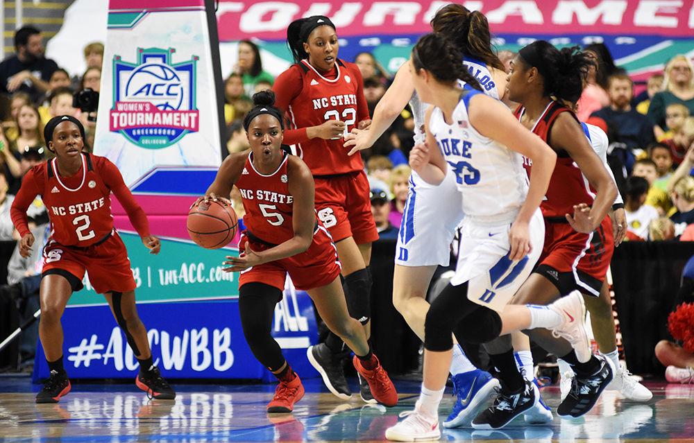 Senior forward Chelsea Nelson runs the ball up the court at the ACC women's basketball quarterfinal against Duke University in Greensboro Coliseum on Friday, Mar. 2, 2018. Nelson set an ACC tournament record of 22 rebounds during the match. The Wolfpack won against the Blue Devils 51-45.