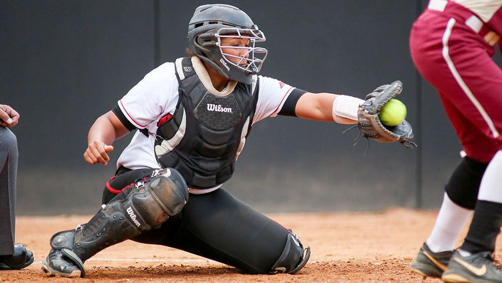 Freshman catcher Cheyenne Balzer catches a ball that Elon missed. Balzer had four at bats with one hit and one run in the 4-2 loss to the Eagles on April 6th at Dail Softball Stadium.