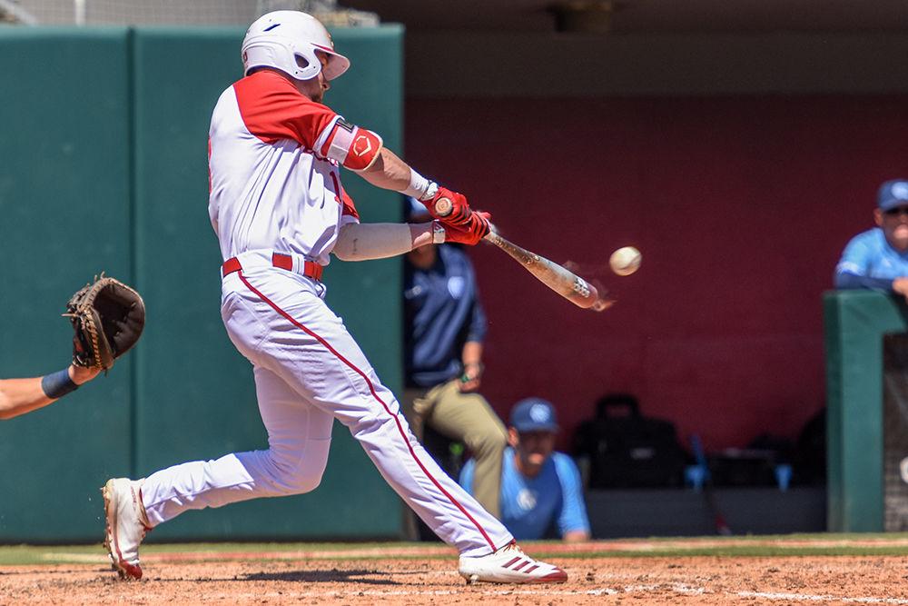 Senior outfielder Brock Deatherage hits a home run during the game versus UNC Chapel Hill on Sunday, April 29, 2018 in Doak Field at Dail Park. Deatherage had a career first after hitting two home runs versus the Heels. The Wolfpack lost to the Tar Heels 5-4.