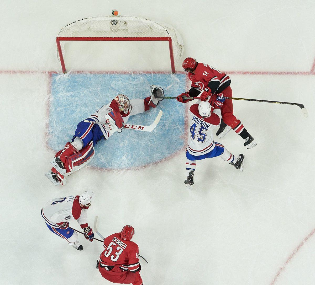 Hurricanes right wing Justin Williams fights Habs goalie Carey Price for the puck in the second period at PNC Arena on Wednesday, Dec. 27 for a 3-1 Canes win. The Canes have now recorded five straight home wins, the longest such streak of the season.