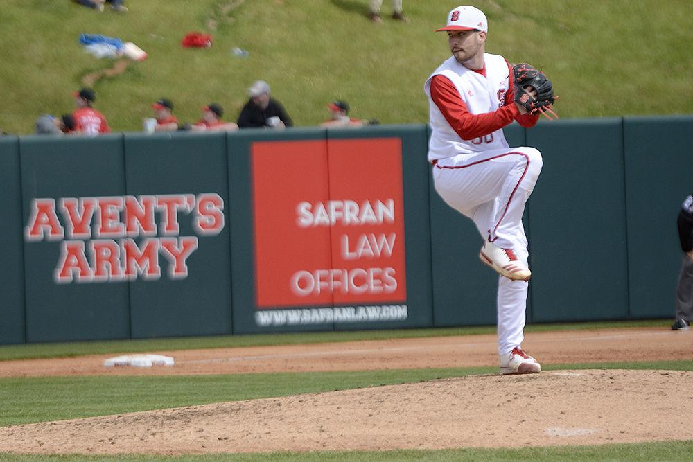 Senior pitcher Brian Brown winds up to pitch on Sunday, March 25 at Doak Field. Brown pitched 6.1 innings, giving up 0 earned runs and striking out 3 as the Wolfpack won 9-6.