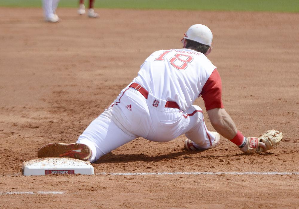 Junior infielder Evan Edwards stretches to put out a Georgia Tech batter on Sunday, March 25 at Doak Field. Edwards went 3-4 with 2 home runs and 4 runs batted in as the Wolfpack won 9-6.
