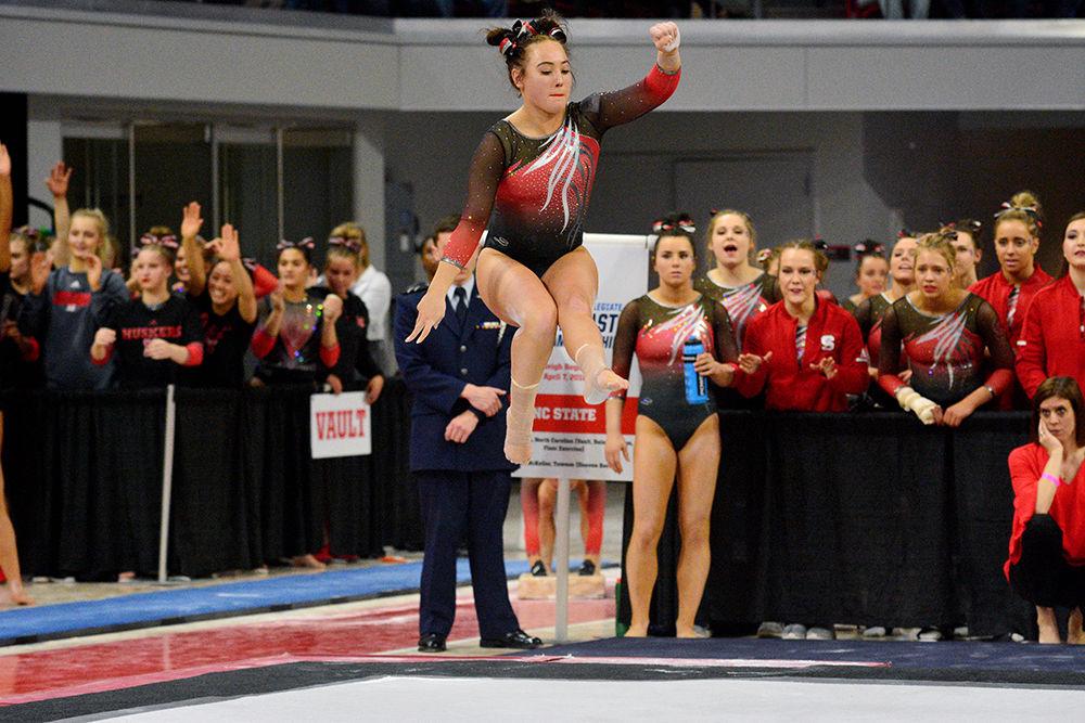 Sophomore Alexis Beucler does a jump as part of her floor routine in the NCAA Regional Championship in Reynolds Coliseum on Saturday. She scored 9.750 in this event.