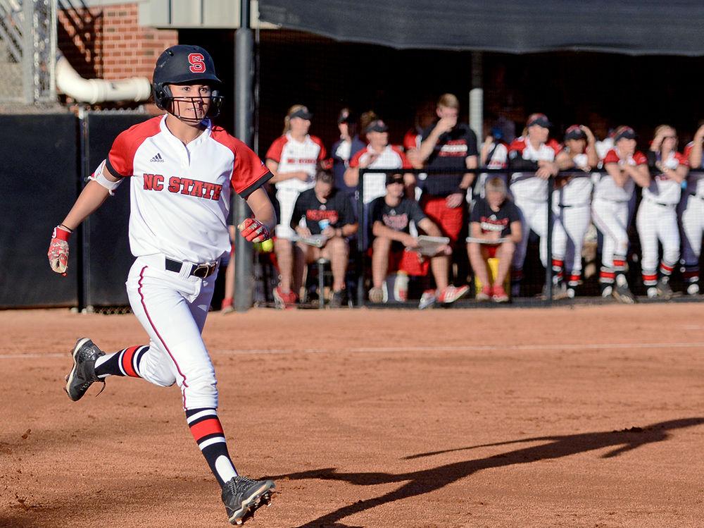 Sophomore outfielder Angie Rizzi runs toward first base after a base hit during the game against East Carolina. The Wolfpack would win the game 8-1, the first game of a doubleheader in Dail Softball Stadium on Oct. 6.