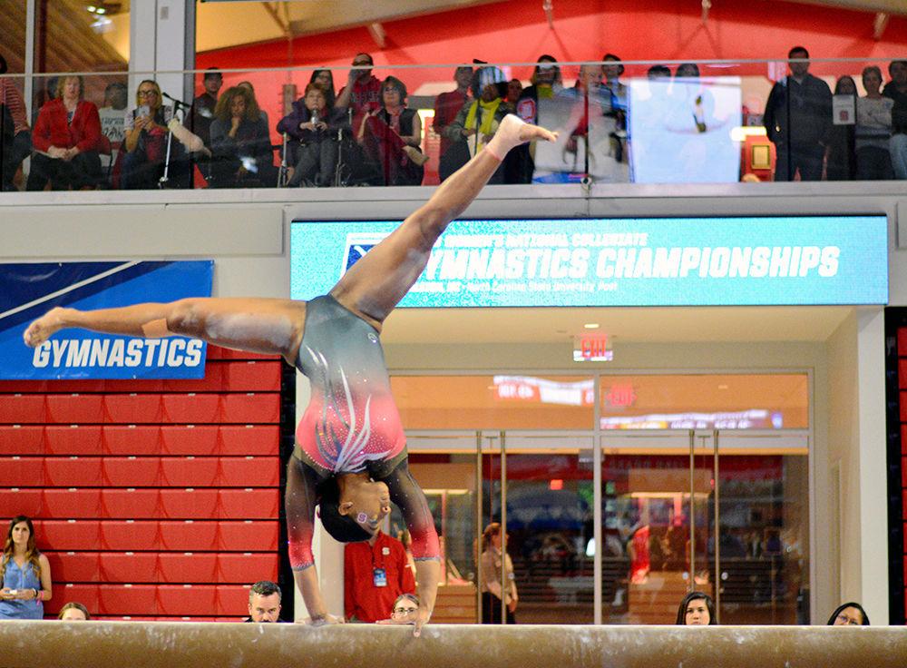 Senior Chelsea Knight performs on the beam in the NCAA Regional Championship in Reynolds Coliseum on Saturday. She scored 9.750 in this event.