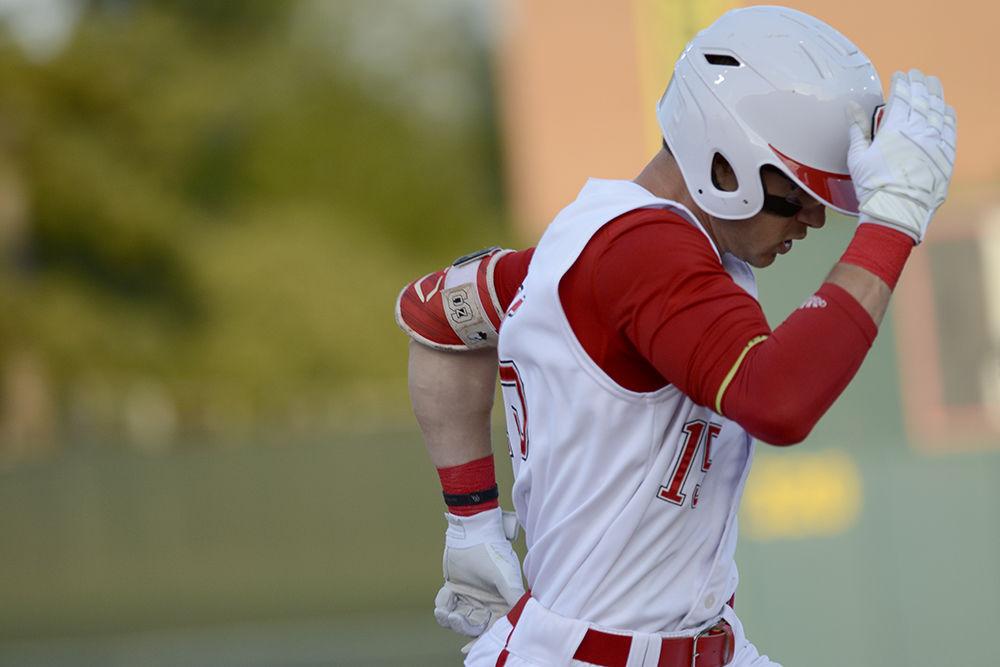 Senior outfielder Josh McLain beats the throw to first base against Notre Dame on Friday, April 13 at Doak Field. McLain went 4-5 with one home run and two RBIs as the Wolfpack lost 12-8.