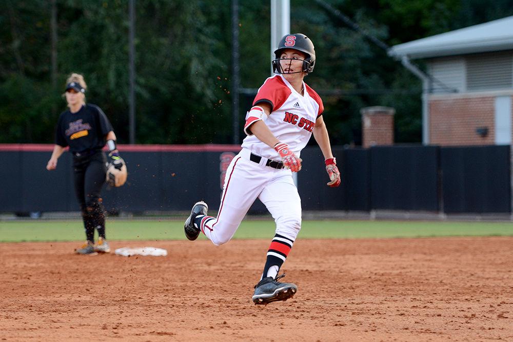 Sophmore outfielder Angie Rizzi rounds second base as she watches the ball go into the outfield during the game against ECU. The Wolfpack defended Dail Softball Stadium winning game one 8-1 and tying game two 5-5 on Oct 6.