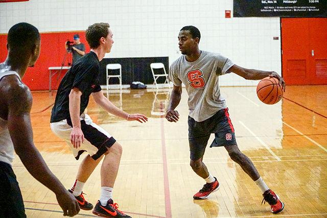 Quante Lee, a junior studying chemical engineering, makes a move at a club basketball scrimmage which was held on in Carmichael Gymnasium Wednesday, Oct. 14.