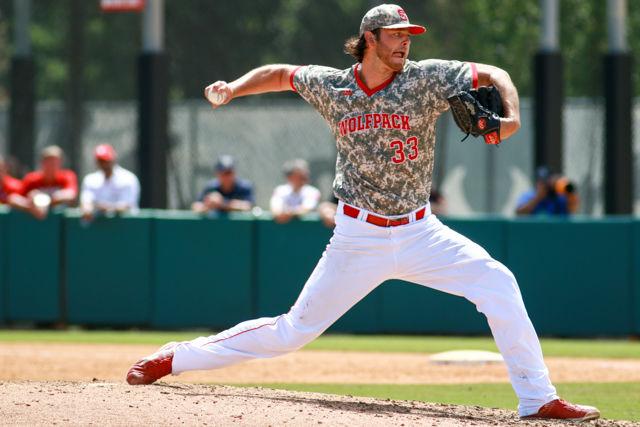 Redshirt junior pitcher Johnny Piedmonte lunges forward to pitch the ball to a Navy Midshipmen batter in the Wolfpack's third game of the NCAA Raleigh Regional on June 5, 2016. Piedmonte pitched a career high 8.2 innings allowing just 6 hits and 1 run in the 17-1 win at Doak Field.