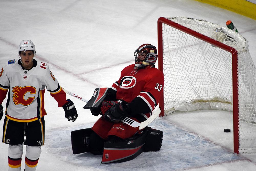 Goalie Scott Darling leans back in frustration after failing to catch the puck. The Carolina Hurricanes faced off against the Calgary Flames, Sunday, Jan. 14, in PNC Arena. The Canes lost, 4-1.