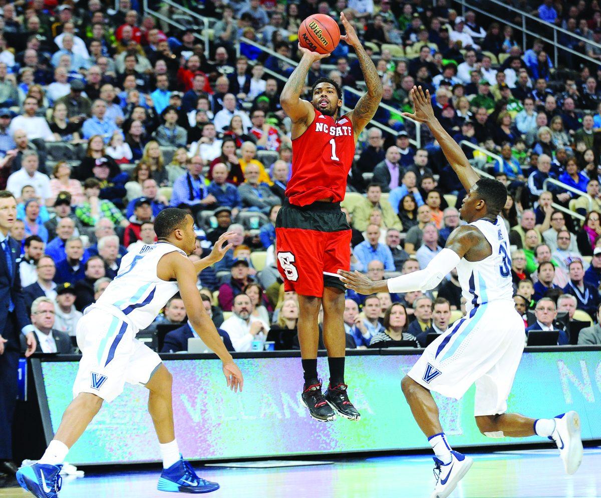 Redshirt junior guard Trevor Lacey shoots a three pointer at the buzzer to end the first half of NC State's 3rd round game of the NCAA Tournament against Villanova Saturday, March 21, 2015. Lacey had 17 points in the Wolfpack's 71-68 win over the No. 1 seed Wildcats at CONSOL Energy Center in Pittsburgh, PA.