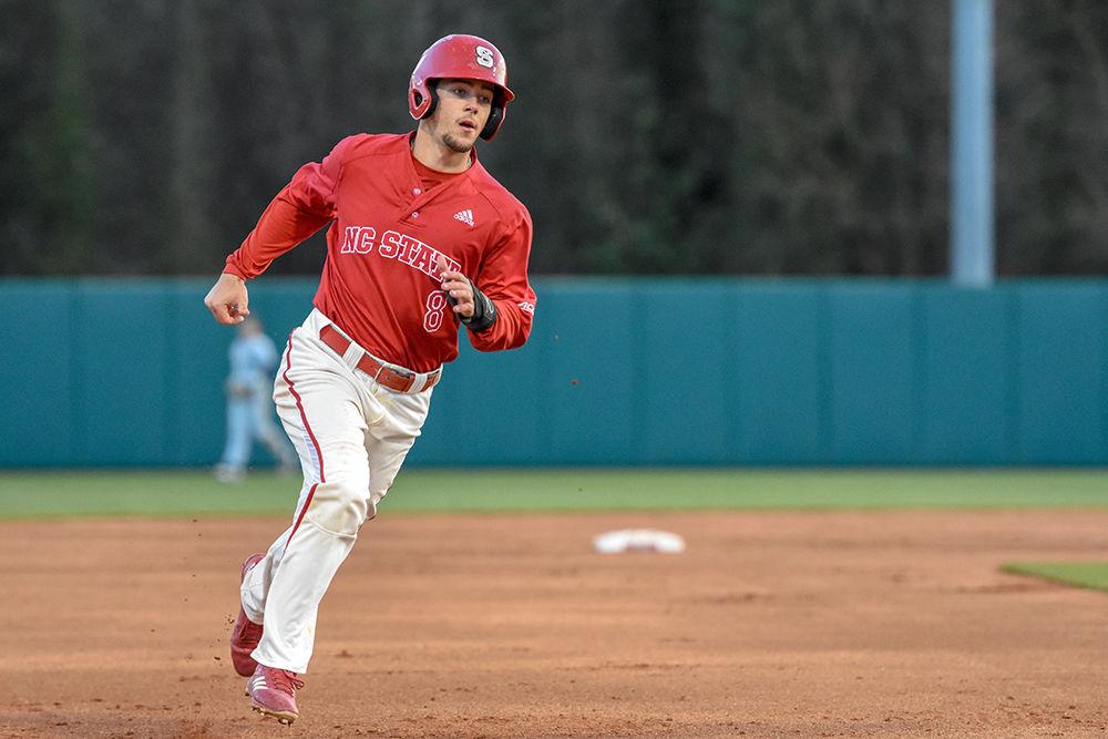 Sophomore infielder Will Wilson runs to third base during the double-header game versus Georgia Tech on Friday, March 23, 2018 in Doak Field at Dail Park. Although losing 13-4 to the Yellow Jackets in the first game, the Wolfpack came back to win the second match-up 5-2.