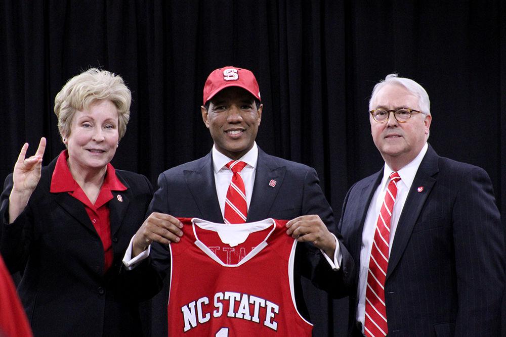 Athletics Director Debbie Yow, new men's basketball coach Kevin Keatts, and Chancellor Randy Woodson pose for a photo during the introductory press conference for Keatts in Reynolds Coliseum on March 19. Keatts replaced Mark Gottfried as mens basketball coach. Keatts spoke during the conference on his plans for next season and his transition from UNC-Wilmington to NC State.