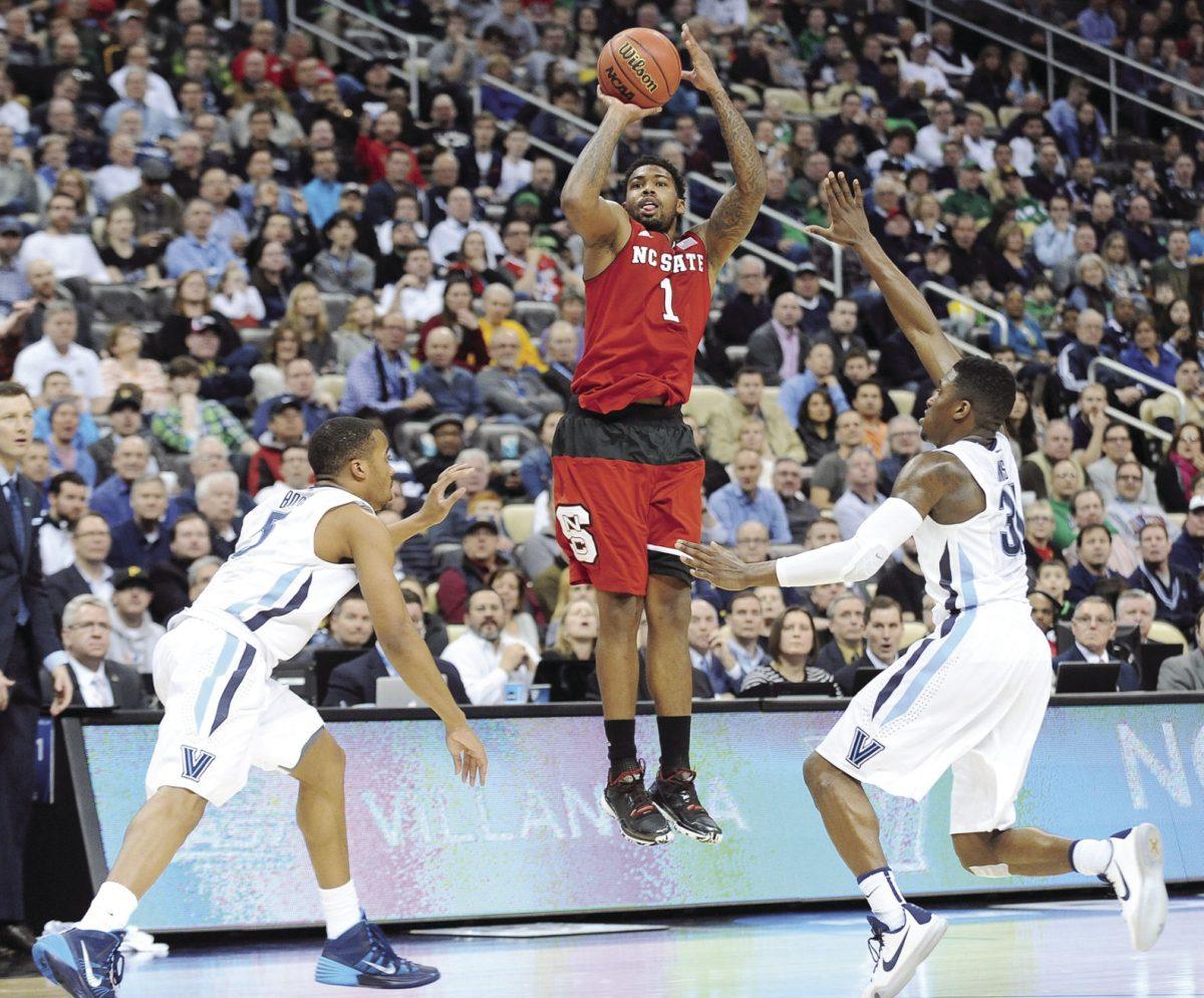 Redshirt junior guard Trevor Lacey shoots a three pointer at the buzzer to end the first half of NC State's 3rd round game of the NCAA Tournament against Villanova Saturday, March 21, 2015. Lacey had 17 points in the Wolfpack's 71-68 win over the No. 1 seed Wildcats at CONSOL Energy Center in Pittsburgh, PA.