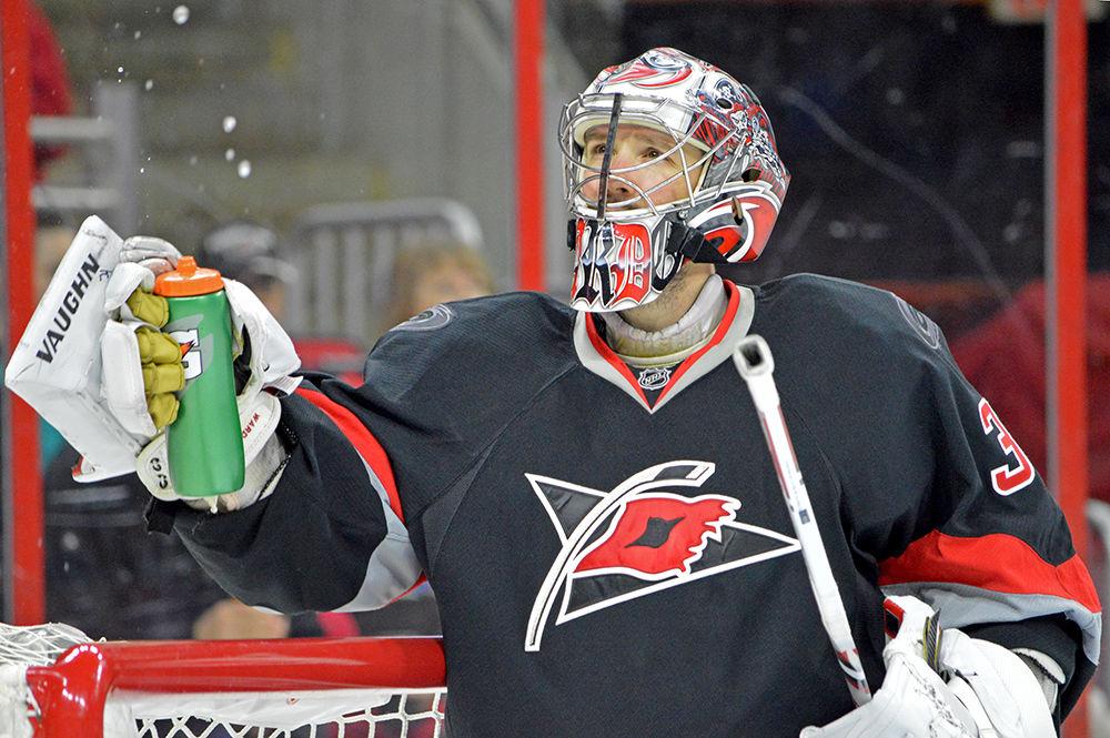 Cam Ward, the goaltender for the Carolina Hurricanes, drinks after re-entering the rink after second intermission. The Carolina Hurricanes played against the Vancouver Canucks on Friday, Jan. 15, 2016 in the PNC Arena. The Hurricanes lost against the Canucks in overtime, 3-2.