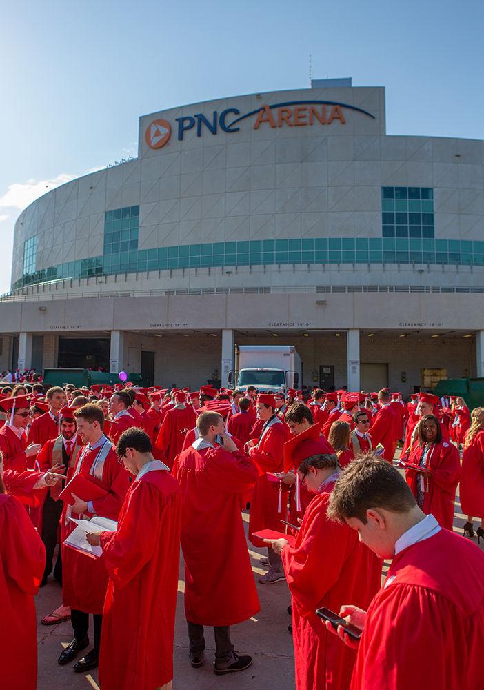Students congregate with their respective colleges outside of PNC Arena prior to the start of Spring Commencement on Saturday, May 12.