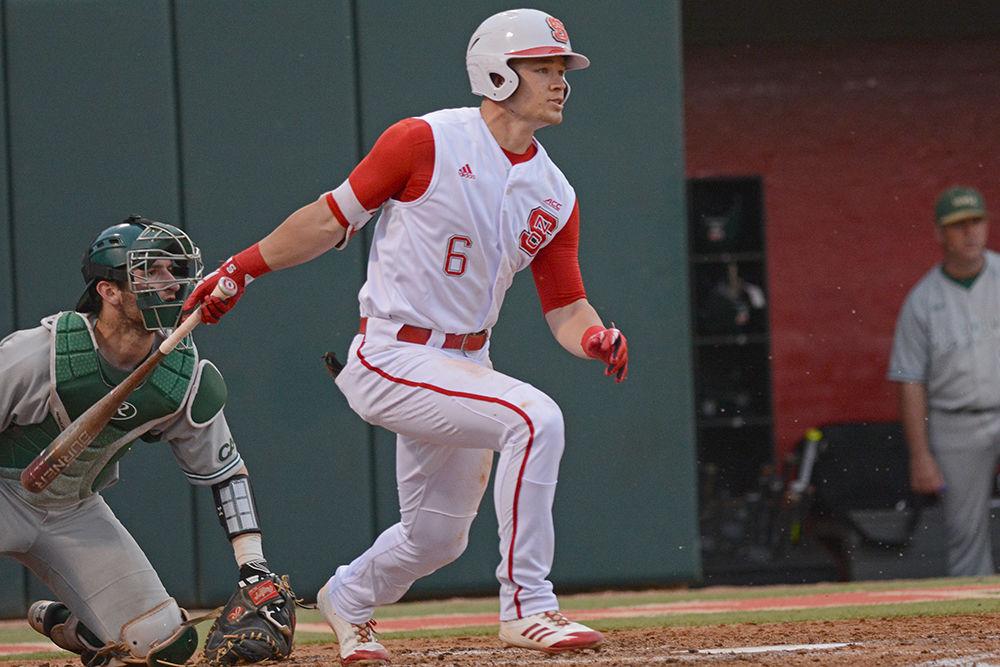 Junior outfielder Brett Kinneman gets a base hit on Saturday at Doak Field. Kinneman went 1-3 with 1 walk as the Wolfpack beat William &amp; Mary 8-4.