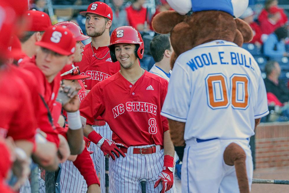 Sophomore infielder Will Wilson stands with Wool E. Bull and the team prior to the game against UNC at the Durham Bulls Athletic Park on Tuesday, April 17. The Wolfpack ended with an 8-3 win.
