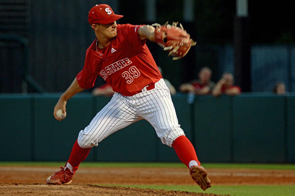 Redshirt junior pitcher Nolan Clenney delivers a pitch on Friday at Doak Field. The Wolfpack won the first game of the series against Wake Forest 8-5.