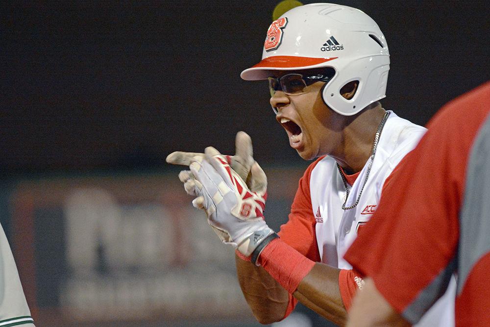 Freshman outfielder Terrell Tatum celebrates a late-game base hit against on Saturday at Doak Field. Tatum went 1-2 with 1 run scored as the Wolfpack beat William &amp; Mary 8-4.
