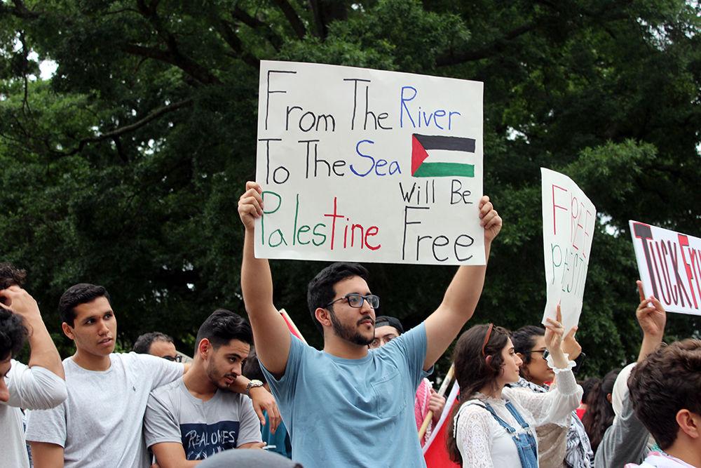 Protesters stand in front of the State Capitol building in Downtown Raleigh for an emergency protest to stand in solidarity with Palestine, Friday, May 19.&#160;