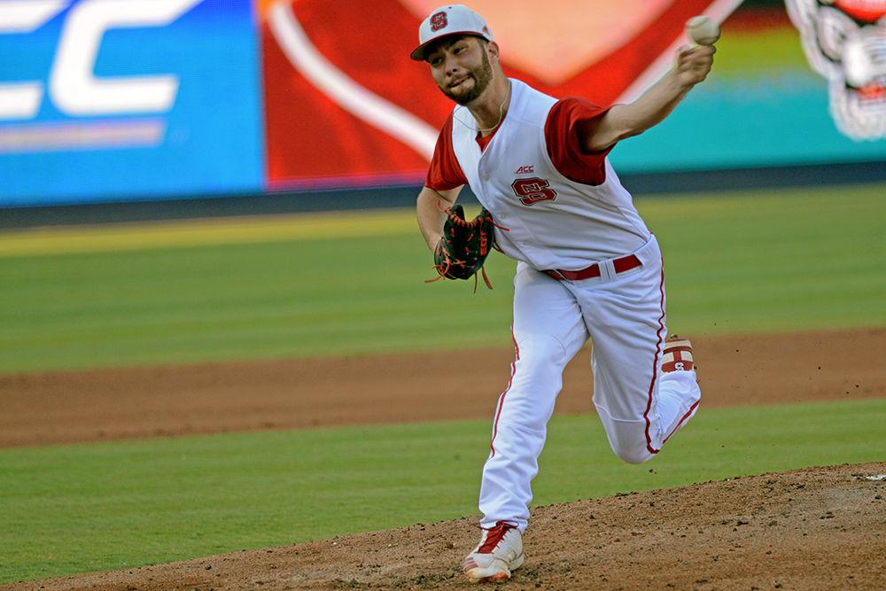 Senior pitcher Brian Brown pitches the ball against Florida State at the Durham Bulls Athletic Park on Friday. Brown pitched 2.1 innings, giving up six hits, four earned runs and striking out five batters as the Wolfpack lost 5-2.