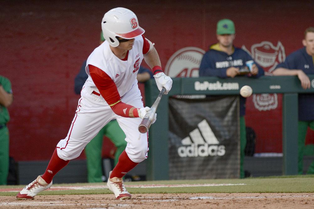 Senior outfielder Josh McLain lays down a bunt against Notre Dame on Friday, April 13 at Doak Field. McLain went 4 for 5 with one home run and two RBIs.