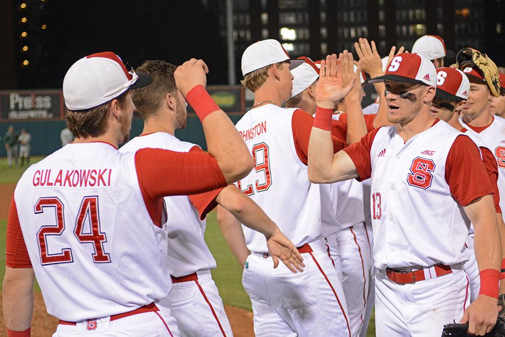The NC State baseball team celebrates their win against William &amp; Mary on Saturday at Doak Field. A six-run eighth inning pushed the Wolfpack to an 8-4 win.