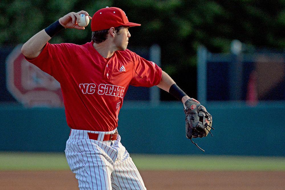 Senior infielder Stephen Pitarra throws the ball to first base on Friday at Doak Field. Pitarra went 1-2 with three runs scored as the Wolfpack beat Wake Forest 8-5.