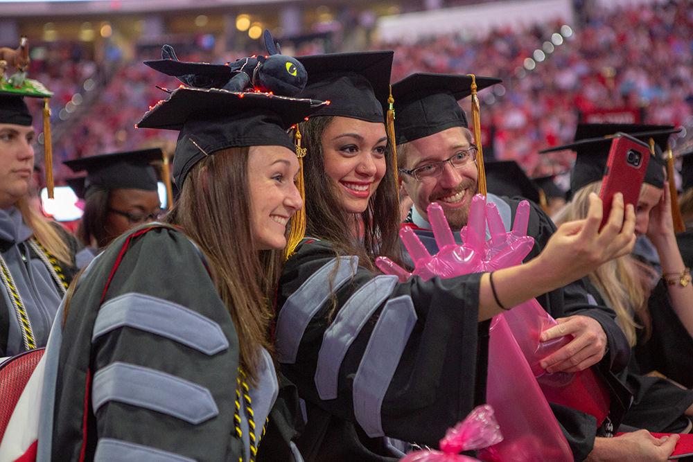 DVM students get together for a selfie while waiting for the processional to finish during the Spring Commencement on Saturday, May 12 in PNC Arena.