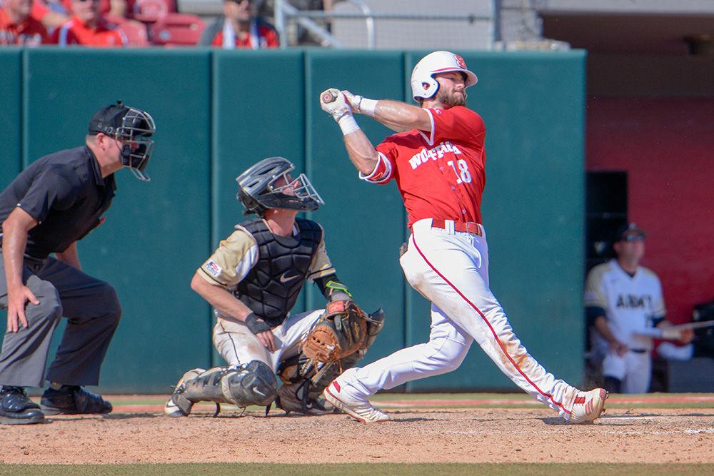 Junior infielder Evan Edwards swings during the game versus Army on Sunday at Doak Field. Edwards scored two home runs against Army and the Wolfpack beat the Black Knights 11-1.