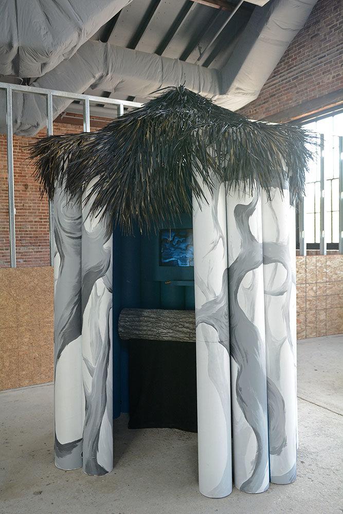 "Aye-aye Behavior and Vocalizations" is a piece on display at Transfer Food Co. off of E. Davie St. in Raleigh. This piece is designed to teach observers about the aye-aye, a lemur native to Madagascar, and how a mother aye-aye may interact with its young.