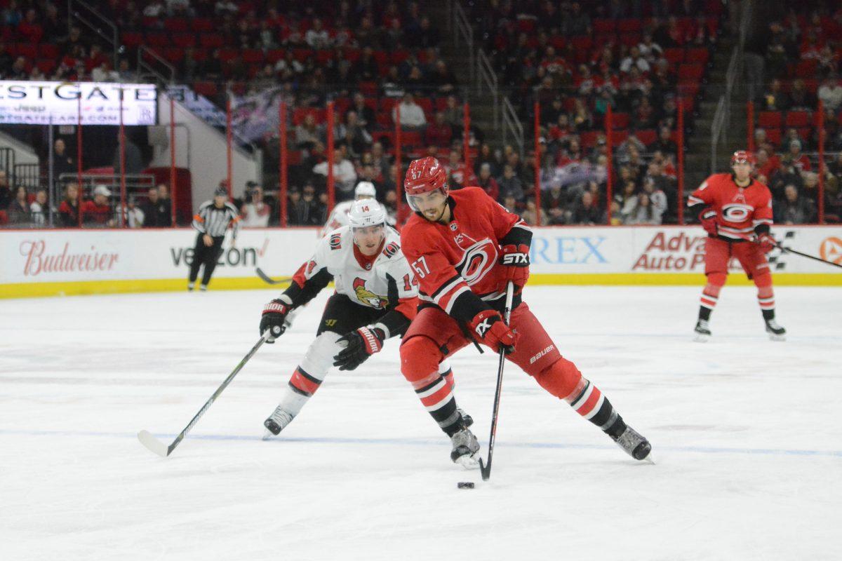 Hurricanes defensemen Trevor van Riemsdyk passes a Senators attacker during the game on Tuesday, Jan. 30. Canes defeated the Senators with a score of 2-1 at PNC Arena. The Canes are currently 8th in the Metropolitan Division.