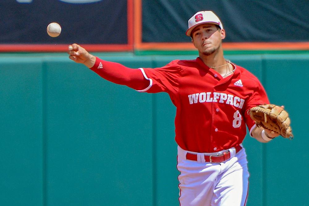 Sophomore infielder Will Wilson throws the ball to first base against Army on Sunday, June 3 at Doak Field. Wilson hit a home run against the Black Knights as the Wolfpack won 11-1.