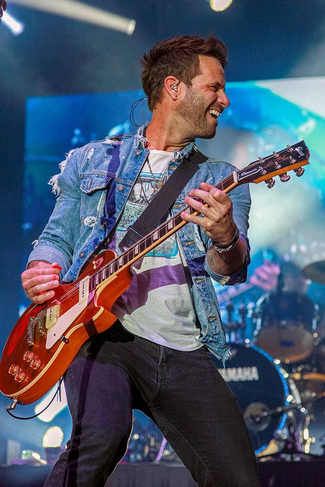 Matt Thomas, lead vocals for Parmalee, jams on his guitar to open the concert at the end of Packapalooza on Saturday, August 25.