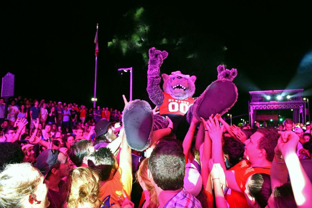 Mr. Wuf crowd surfs at Packapalooza on Saturday, Aug. 19, 2017. Packapalooza is an annual festival held on Hillsborough Street to cap off Wolfpack Welcome Week.
