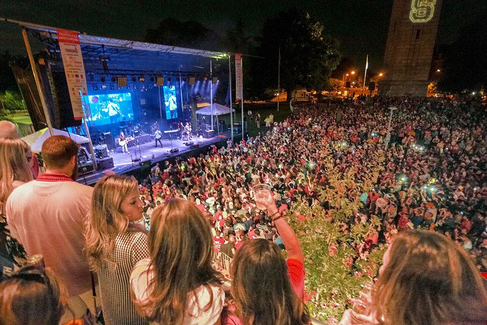 Fans stand on the balcony of Aloft to look over the crowd of hundreds watching the Parmalee concert to conclude Packapalooza on Saturday, August 25.