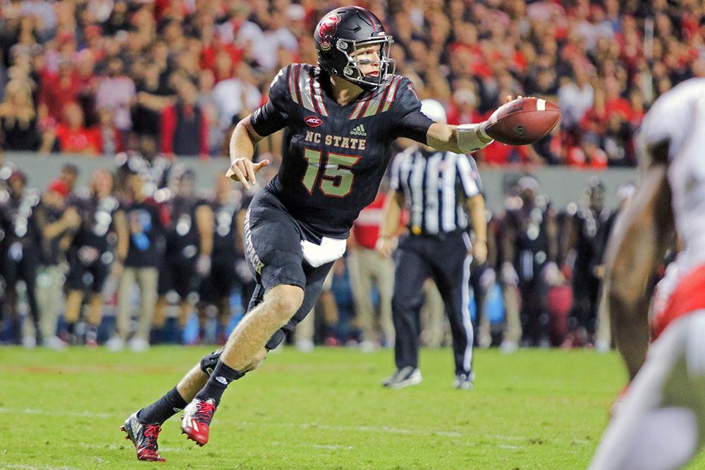 Redshirt junior quarterback Ryan Finley pitches the ball against Louisville at Carter-Finley Stadium on Oct. 5, 2017. Finley passed for 367 yards and rushed for another 19 as the Wolfpack took down Louisville 39-25.