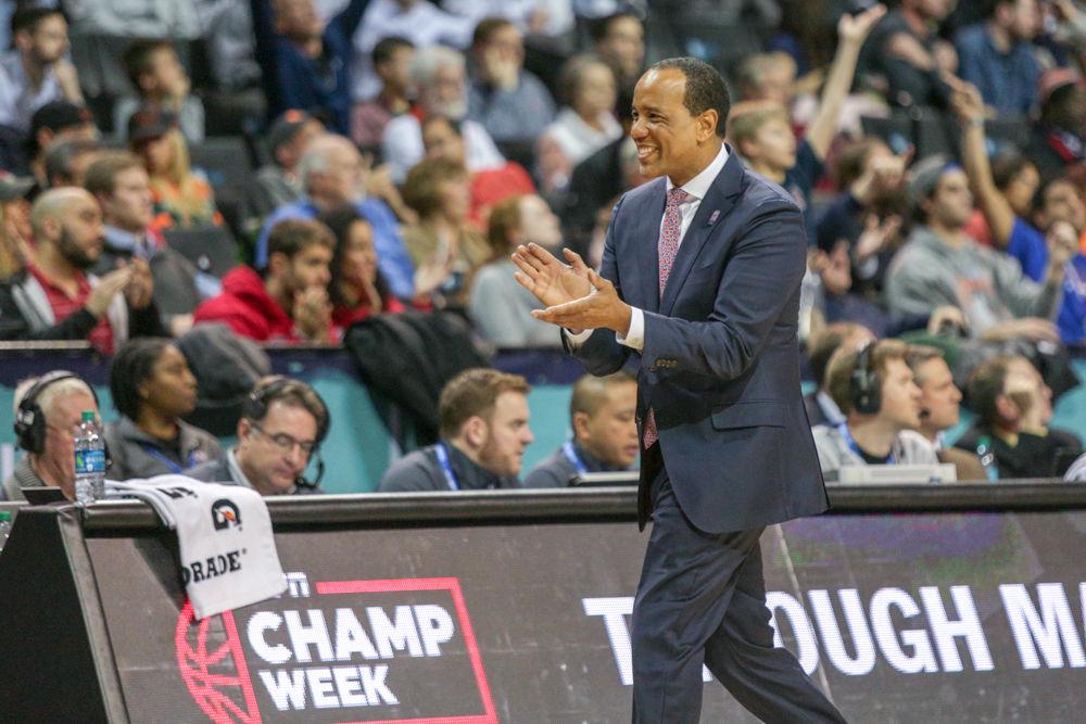 Head coach Kevin Keatts smiles and claps during the ACC Tournament on Wednesday, March 7 at Barclays Center in Brooklyn. The Wolfpack lost their first game 91-87 to Boston College and were eliminated from the tournament as a result.