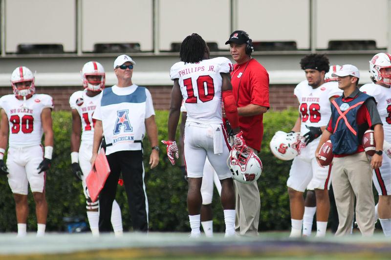 Head coach Dave Dorean talks to sophomore cornerback Freddie Phillips Jr. after his penalty for continuing play after losing a helmet. The Wolfpack fell to ECU 33-30 on Sept. 10th in Dowdy Ficklen Stadium.