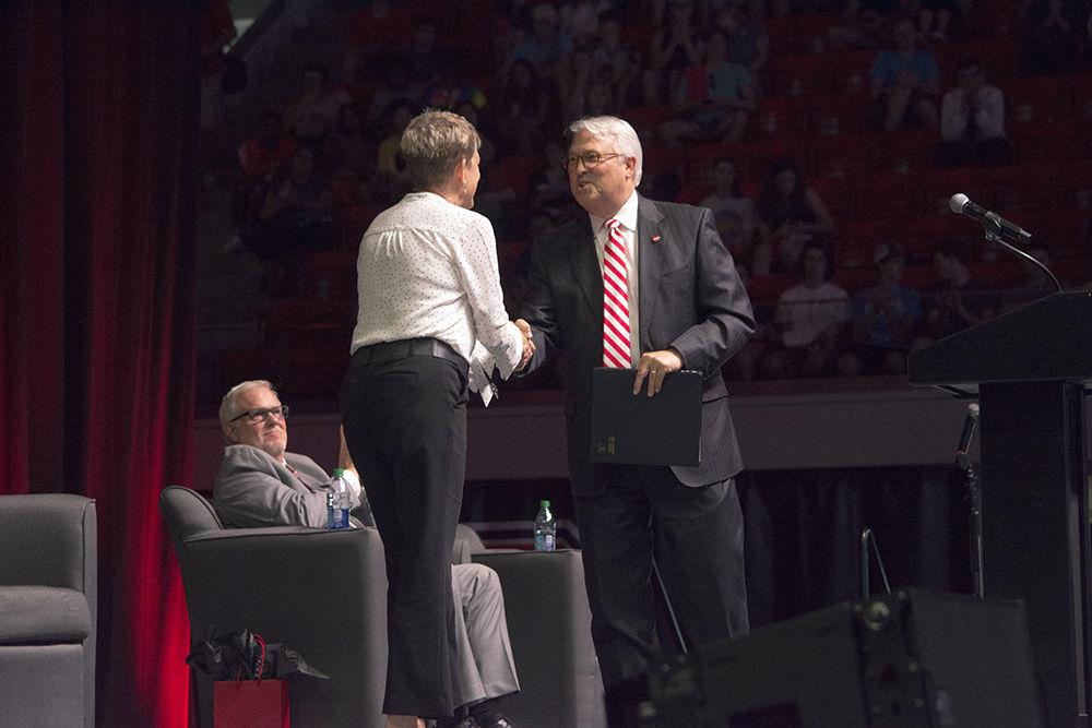 Chancellor Randy Woodson shakes the hand of Kathryn J. Edin, renowned author, prior to Dr. Edin's convocation keynote speech. The Class of 2022 was formally welcomed to the Wolfpack during Convocation on Monday, Aug. 20 in Reynolds Colesium.