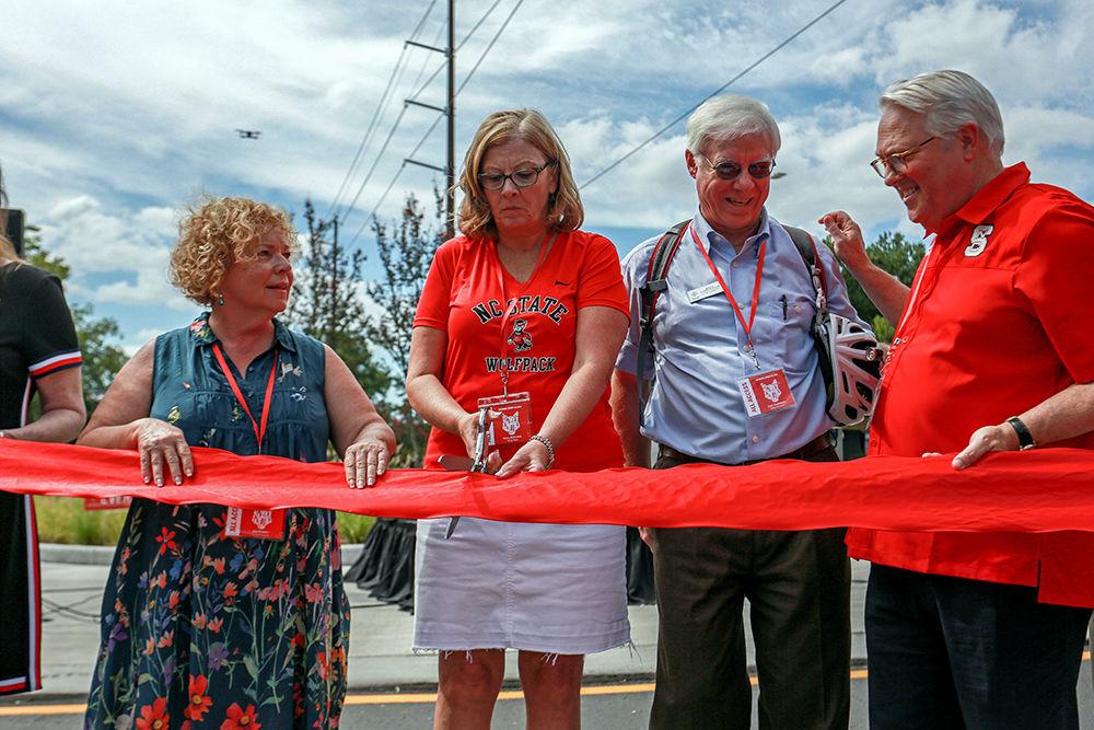 Raleigh mayor Nancy McFarlane cuts the ribbon to phase two of the Hillsborough Street reconstruction with members of the university and Raleigh City Council. The ribbon cutting occurred early into Packapalooza, a yearly event open to the public at large. Packapalooza was held on Saturday, August 25 on Hillsborough Street in Raleigh, NC.&#160;&#160;